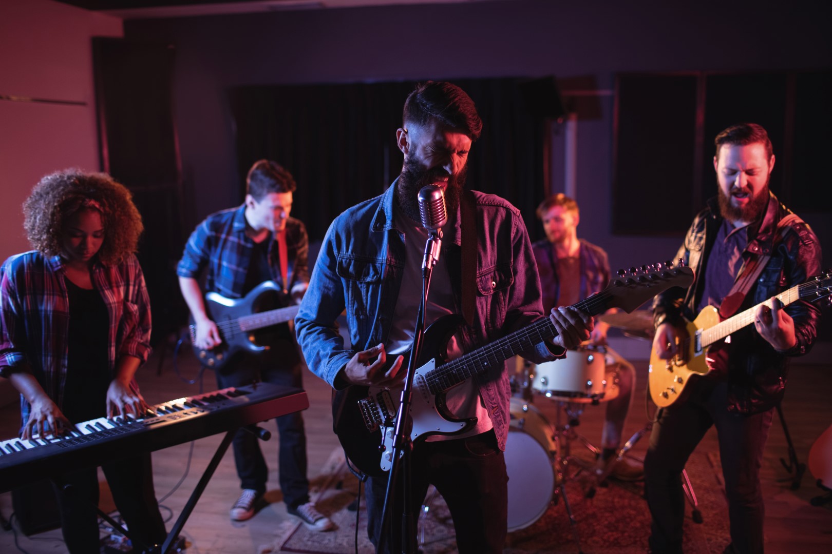 Band performing in recording studio Band performing in recording studio