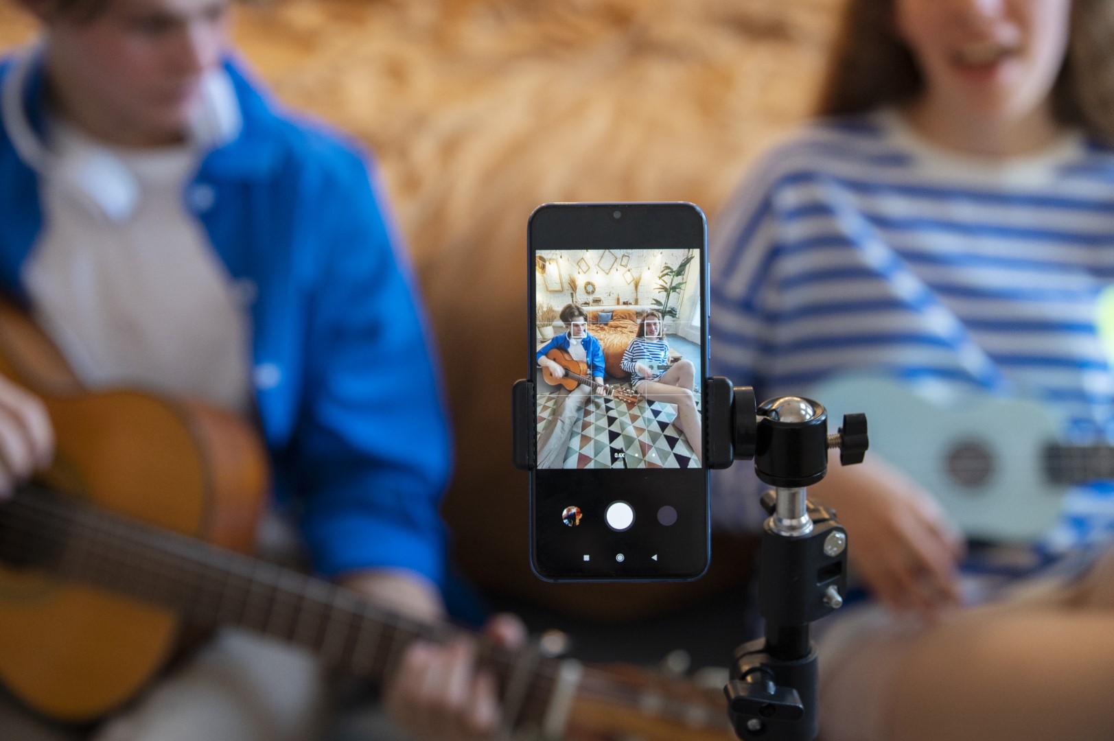 teenage-boy-girl-recording-music-their-home-studio-with-guitar